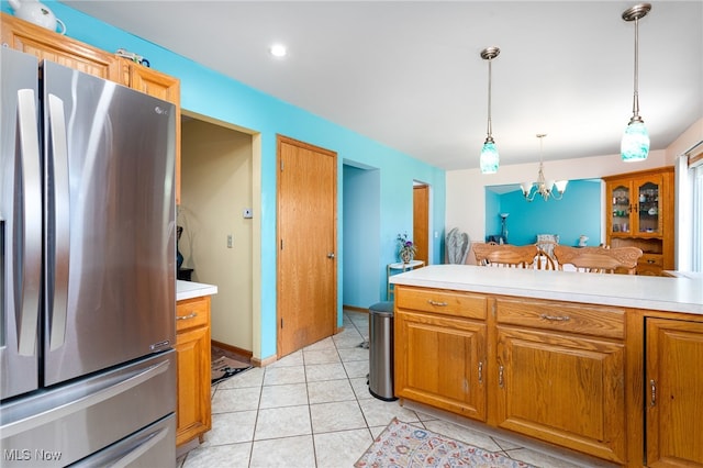 104 Joshua Dr, Rittman, OH 44270 - kitchen with stainless steel refrigerator with ice dispenser, light countertops, a chandelier, and pendant lighting