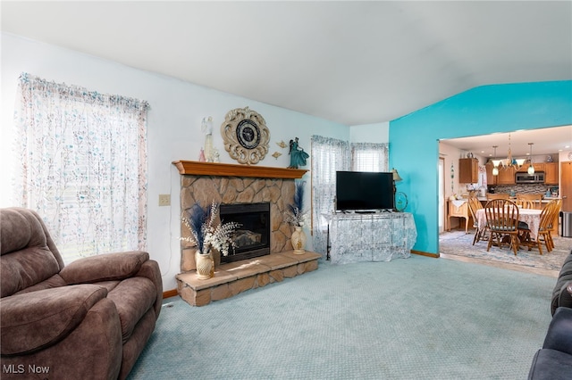 104 Joshua Dr, Rittman, OH 44270 - carpeted living room featuring lofted ceiling, a stone fireplace, and baseboards