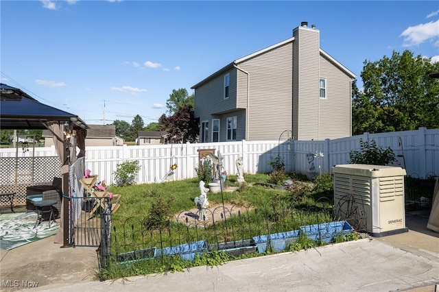 104 Joshua Dr, Rittman, OH 44270 - view of side of home featuring a gazebo, a chimney, a fenced backyard, and a patio