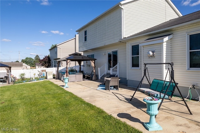 104 Joshua Dr, Rittman, OH 44270 - back of property with entry steps, a gazebo, and a patio