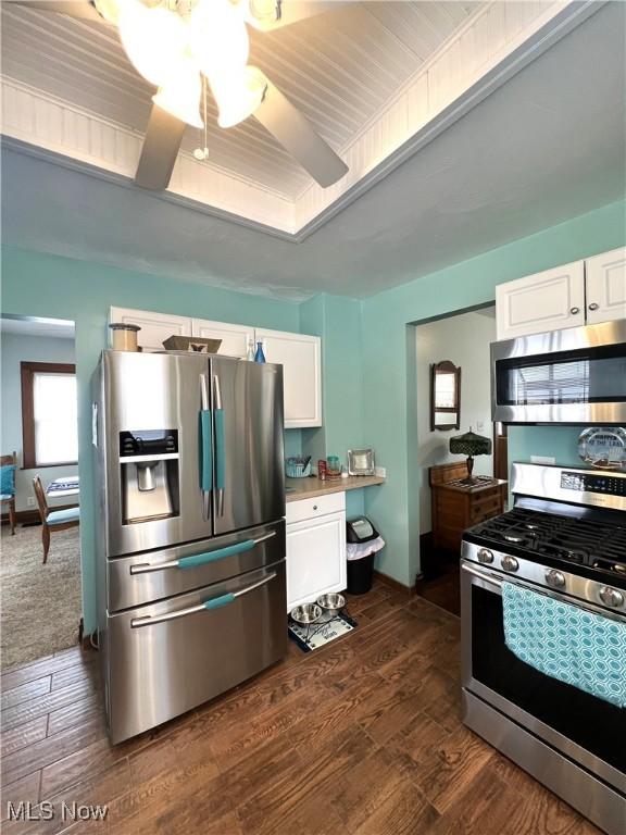 2024 W 10th St, Ashtabula, OH 44004 - kitchen with appliances with stainless steel finishes, white cabinets, dark wood finished floors, and ceiling fan