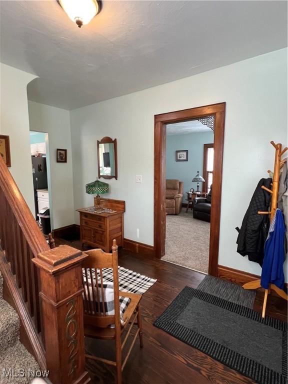 2024 W 10th St, Ashtabula, OH 44004 - interior space featuring baseboards, wood finished floors, and stairway