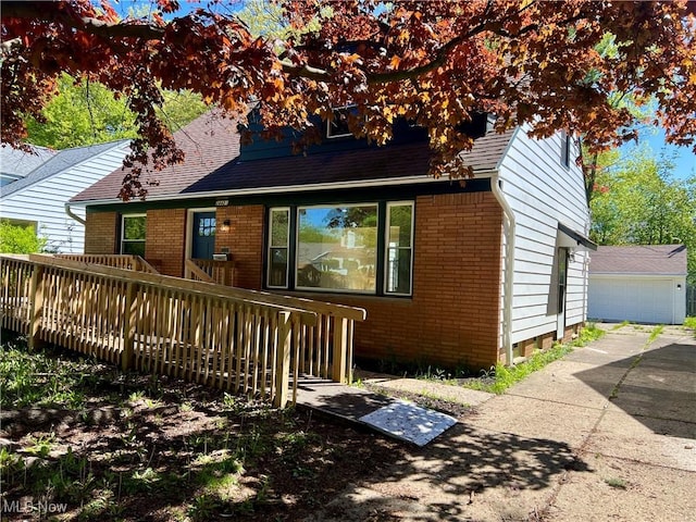 24421 Effingham Blvd, Euclid, OH 44117 - back of house featuring brick siding, a wooden deck, and a shingled roof