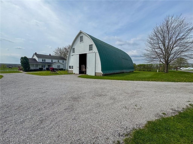 16321 Burton Windsor Rd, Middlefield, OH 44062 - view of pole building with a lawn and driveway