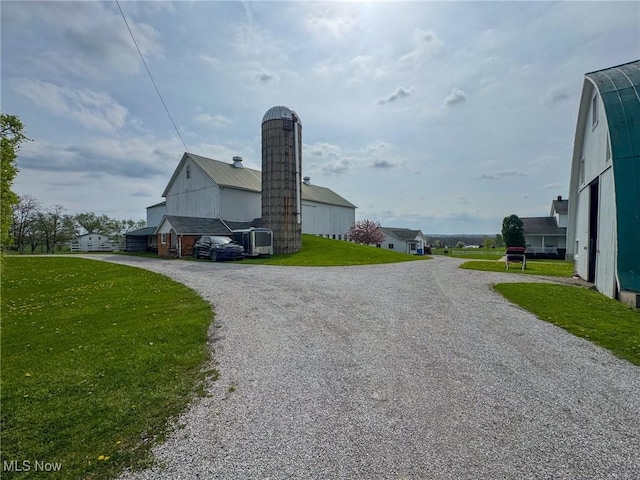 16321 Burton Windsor Rd, Middlefield, OH 44062 - view of property exterior featuring driveway and a lawn