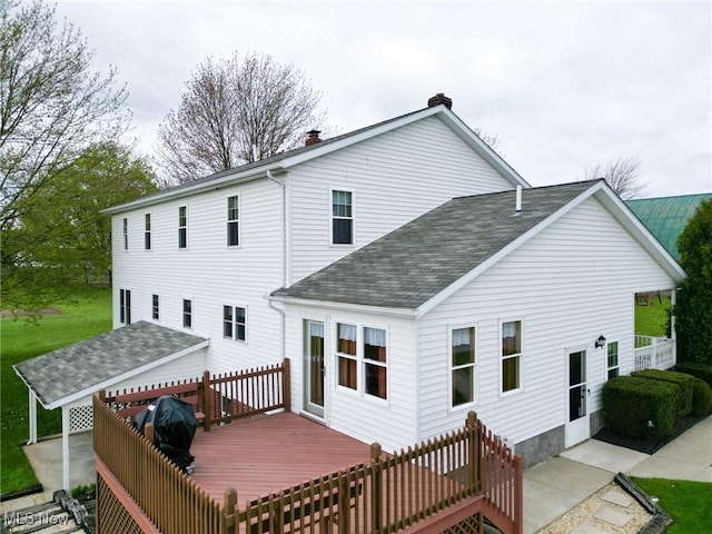 16321 Burton Windsor Rd, Middlefield, OH 44062 - back of house with roof with shingles, a deck, and a chimney