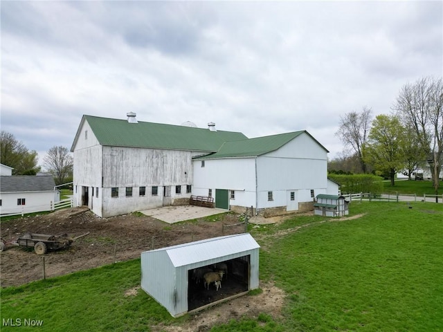 16321 Burton Windsor Rd, Middlefield, OH 44062 - back of property featuring an outbuilding, metal roof, and an outdoor structure