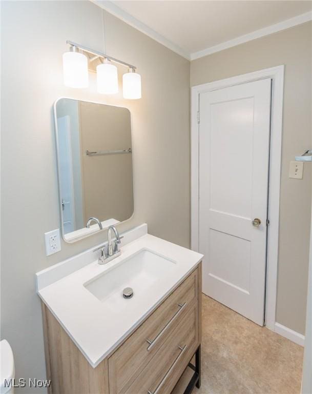 125 E 30th St, Lorain, OH 44055 - bathroom featuring crown molding, vanity, and toilet