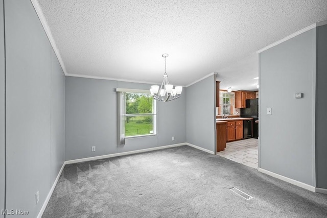 10597 State Route 82, Windham, OH 44288 - unfurnished room featuring crown molding, a chandelier, a textured ceiling, light carpet, and baseboards