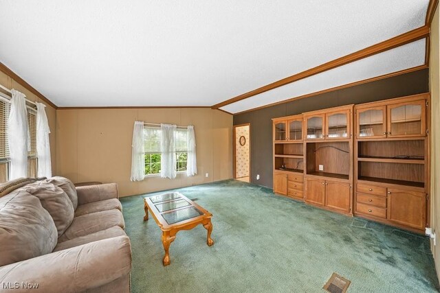 10597 State Route 82, Windham, OH 44288 - living area with ornamental molding, vaulted ceiling, and carpet flooring