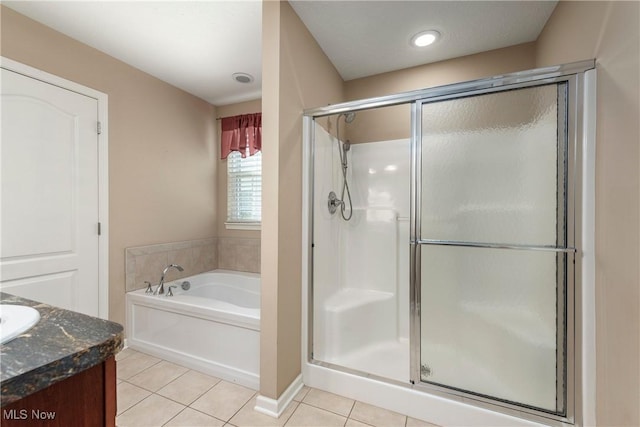 453 Bridge Pointe Ln, Brunswick, OH 44212 - full bath with tile patterned floors, a shower stall, a bath, and vanity