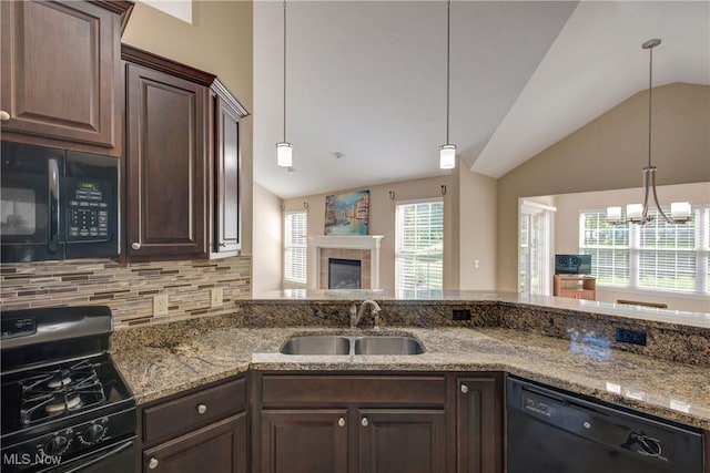 453 Bridge Pointe Ln, Brunswick, OH 44212 - kitchen with a sink, black appliances, vaulted ceiling, dark brown cabinetry, and backsplash