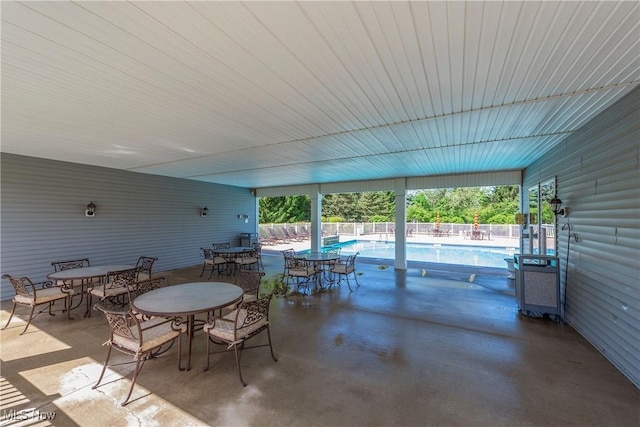 453 Bridge Pointe Ln, Brunswick, OH 44212 - view of patio featuring an indoor pool and outdoor dining area