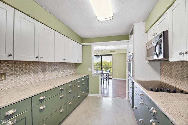 12550 Lake Ave Unit 805, Lakewood, OH 44107 - kitchen with green cabinetry, appliances with stainless steel finishes, white cabinetry, and tasteful backsplash