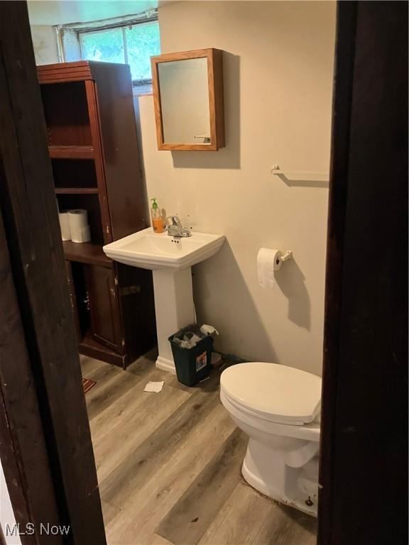 1293 W Jackson St, Painesville, OH 44077 - half bathroom with wood finished floors and toilet