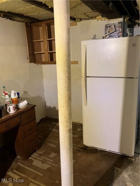 1293 W Jackson St, Painesville, OH 44077 - unfinished below grade area with freestanding refrigerator