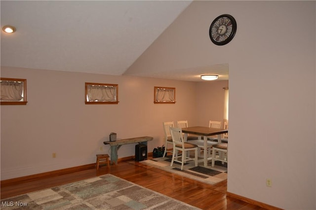 238 E Main St, New London, OH 44851 - dining area with wood finished floors, vaulted ceiling, and baseboards