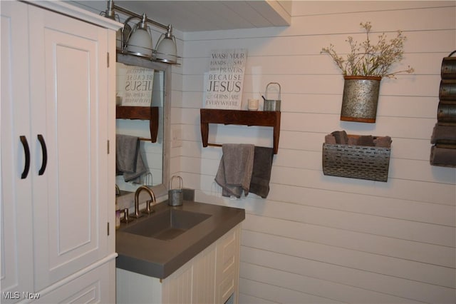 238 E Main St, New London, OH 44851 - bathroom featuring vanity and wood walls