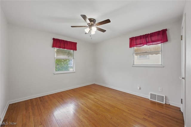 21031 Ball Ave, Euclid, OH 44123 - unfurnished room with hardwood / wood-style flooring, baseboards, and a ceiling fan