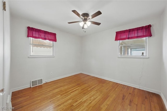 21031 Ball Ave, Euclid, OH 44123 - empty room with light wood finished floors, a ceiling fan, and baseboards
