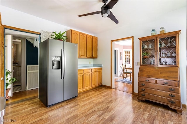 2671 Haddam Rd, Cleveland, OH 44120 - kitchen featuring stainless steel refrigerator with ice dispenser, a ceiling fan, light wood-style floors, and light countertops