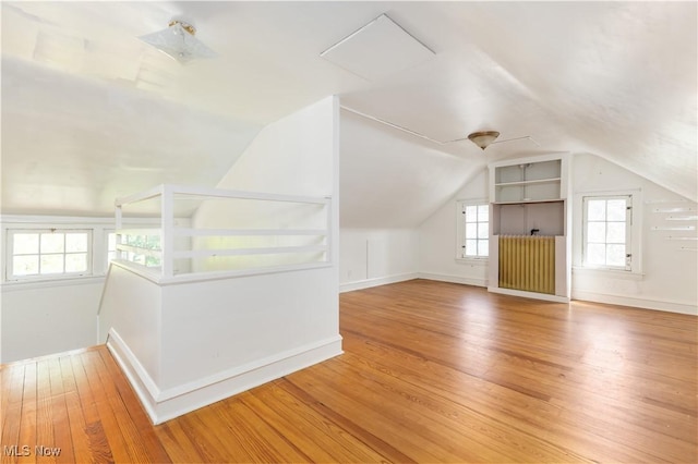 2671 Haddam Rd, Cleveland, OH 44120 - bonus room featuring vaulted ceiling, wood finished floors, baseboards, and attic access