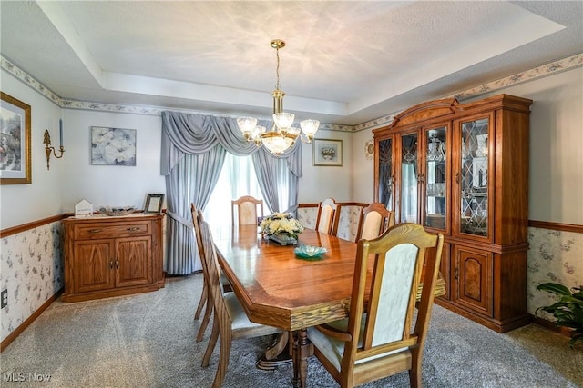 961 Prescot Ave NW, Massillon, OH 44646 - carpeted dining room with wallpapered walls, a tray ceiling, and a chandelier