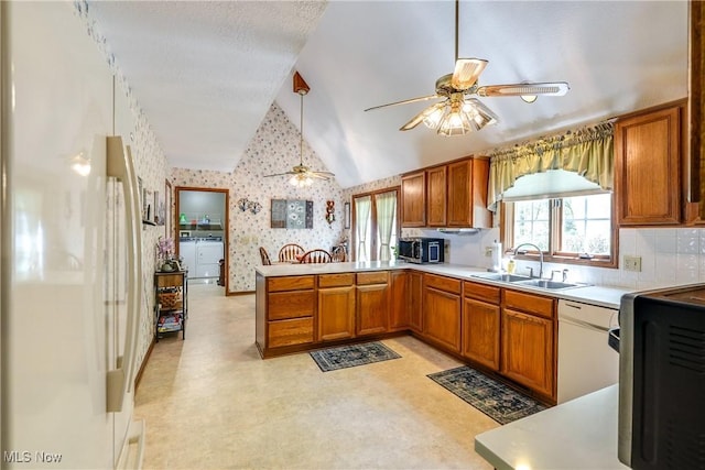 961 Prescot Ave NW, Massillon, OH 44646 - kitchen featuring a sink, white appliances, lofted ceiling, a ceiling fan, and wallpapered walls