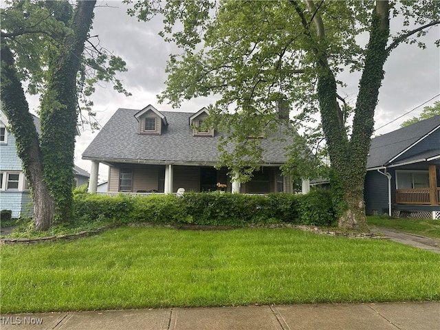 1767 Avalon Rd, Cleveland, OH 44112 - view of front of property with roof with shingles, a front yard, and a porch