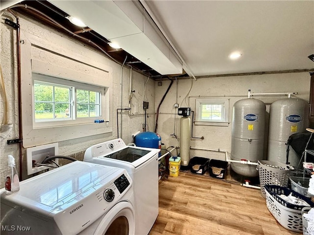 7509 S Palmyra Rd, Canfield, OH 44406 - washroom featuring washing machine and dryer, plenty of natural light, and wood finished floors