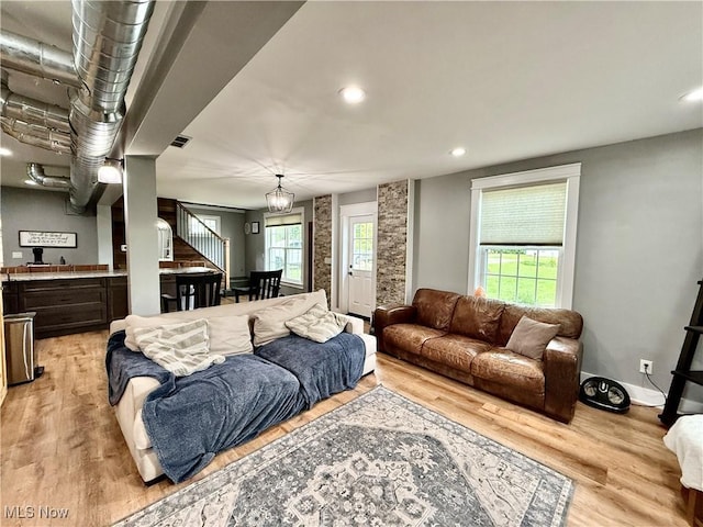 7509 S Palmyra Rd, Canfield, OH 44406 - living room with light wood finished floors, stairway, recessed lighting, and baseboards