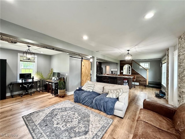 7509 S Palmyra Rd, Canfield, OH 44406 - living room with a barn door, a desk, light wood finished floors, baseboards, and recessed lighting