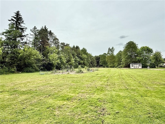 7509 S Palmyra Rd, Canfield, OH 44406 - view of grassy yard featuring a wooded view