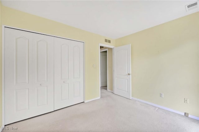 1145 Canyon View Rd Unit 206, Sagamore Hills, OH 44067 - unfurnished bedroom featuring light carpet, baseboards, and a closet