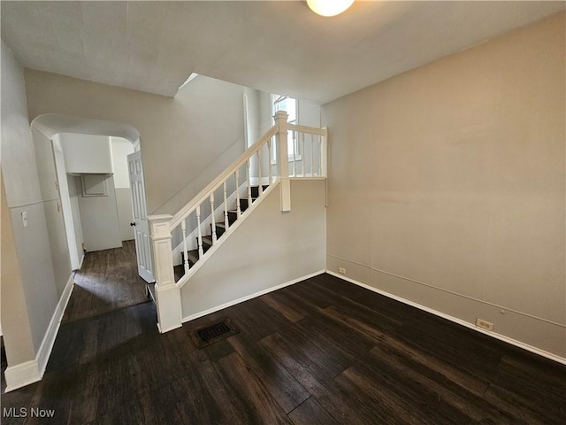 3891 W 21st St, Cleveland, OH 44109 - stairs with wood finished floors, baseboards, and arched walkways