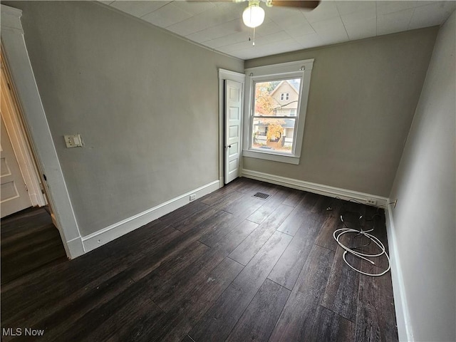 3891 W 21st St, Cleveland, OH 44109 - spare room with a ceiling fan, dark wood finished floors, and baseboards