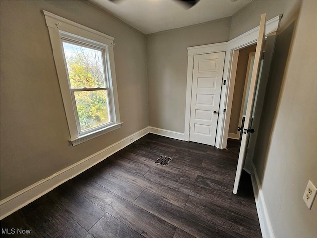 3891 W 21st St, Cleveland, OH 44109 - unfurnished room with dark wood-style flooring and baseboards