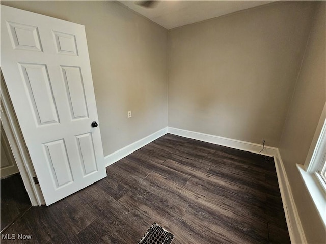 3891 W 21st St, Cleveland, OH 44109 - spare room featuring dark wood-style flooring and baseboards