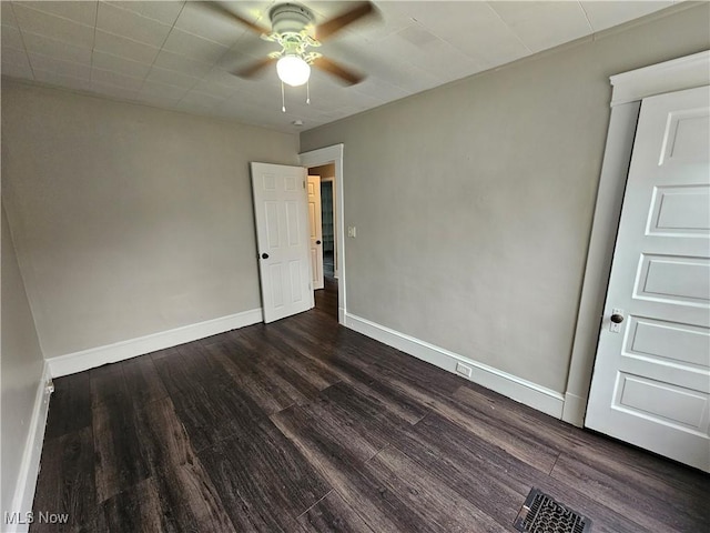 3891 W 21st St, Cleveland, OH 44109 - spare room featuring dark wood finished floors, a ceiling fan, and baseboards