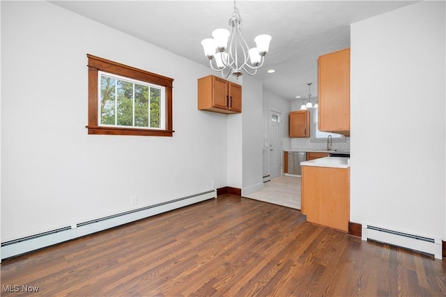 1138 W 6th St, Lorain, OH 44052 - unfurnished dining area with a chandelier, baseboard heating, dark wood-style flooring, a baseboard heating unit, and recessed lighting