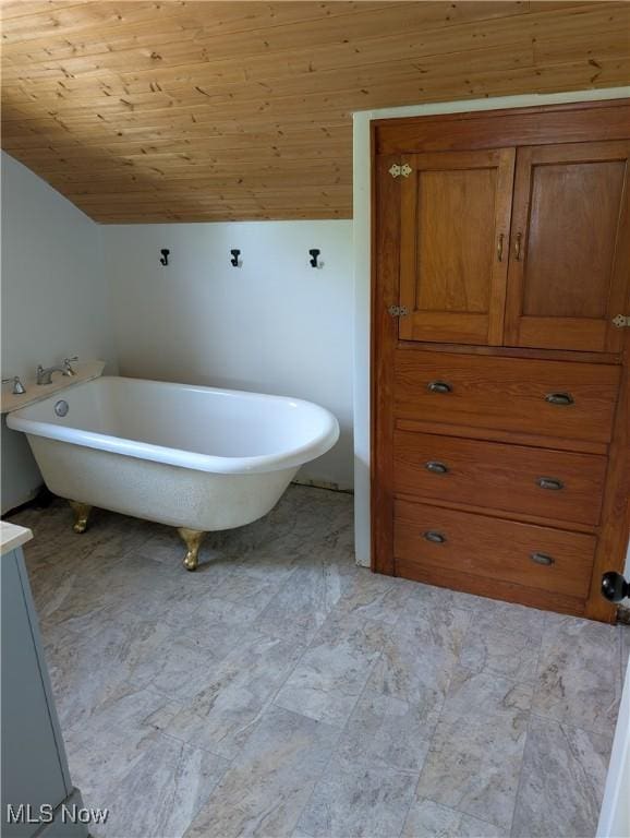 630 N Lincoln Ct, Louisville, OH 44641 - full bathroom featuring a soaking tub, lofted ceiling, and wooden ceiling