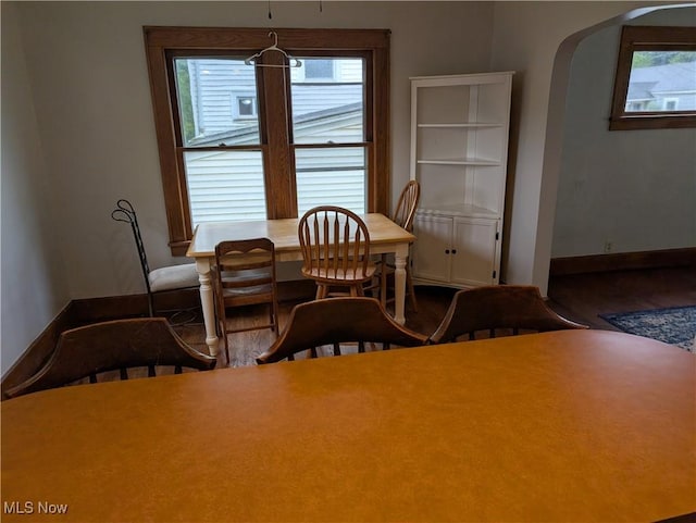 630 N Lincoln Ct, Louisville, OH 44641 - dining room with arched walkways and wood finished floors