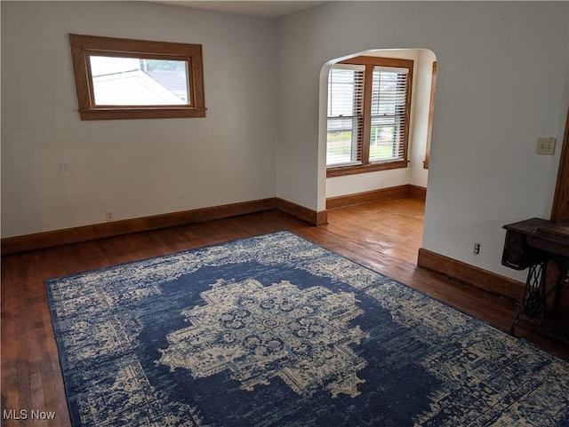 630 N Lincoln Ct, Louisville, OH 44641 - unfurnished room with arched walkways and wood finished floors
