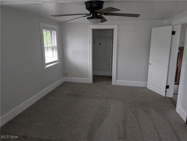 630 N Lincoln Ct, Louisville, OH 44641 - unfurnished bedroom with carpet flooring, a closet, and a ceiling fan