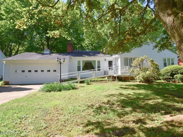4628 Monticello Blvd, South Euclid, OH 44143 - single story home with a chimney, a front lawn, a garage, and concrete driveway