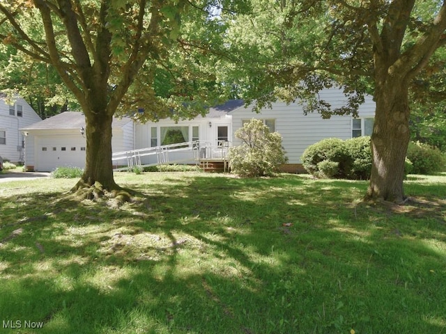 4628 Monticello Blvd, South Euclid, OH 44143 - view of green lawn with an attached garage