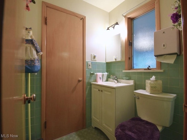 4628 Monticello Blvd, South Euclid, OH 44143 - bathroom with tile walls, toilet, and vanity