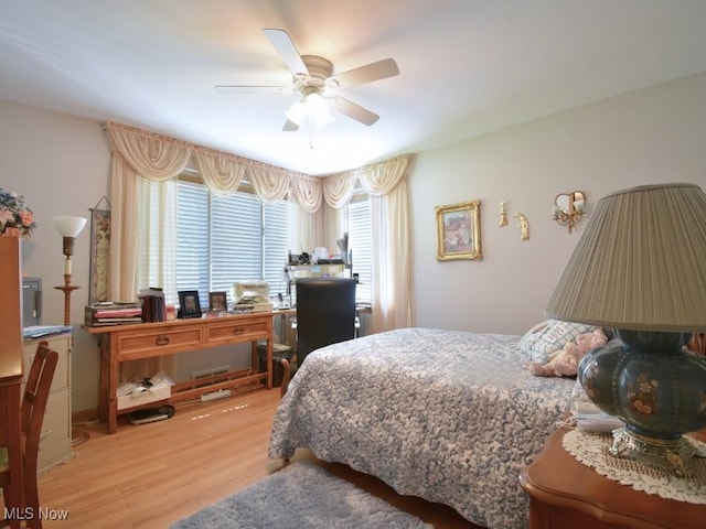 4628 Monticello Blvd, South Euclid, OH 44143 - bedroom featuring light wood-type flooring, a ceiling fan, and an office area