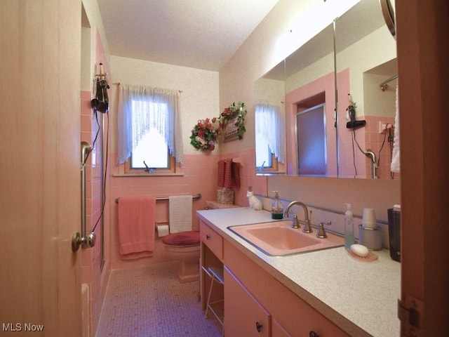 4628 Monticello Blvd, South Euclid, OH 44143 - full bath featuring tile walls, a shower, toilet, and vanity