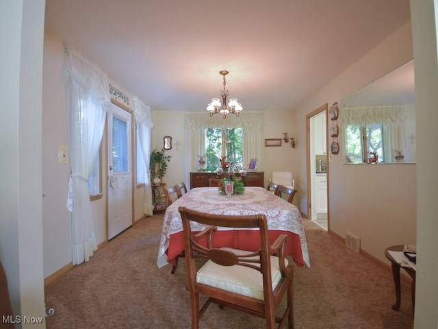 4628 Monticello Blvd, South Euclid, OH 44143 - dining room featuring a chandelier, light colored carpet, and baseboards
